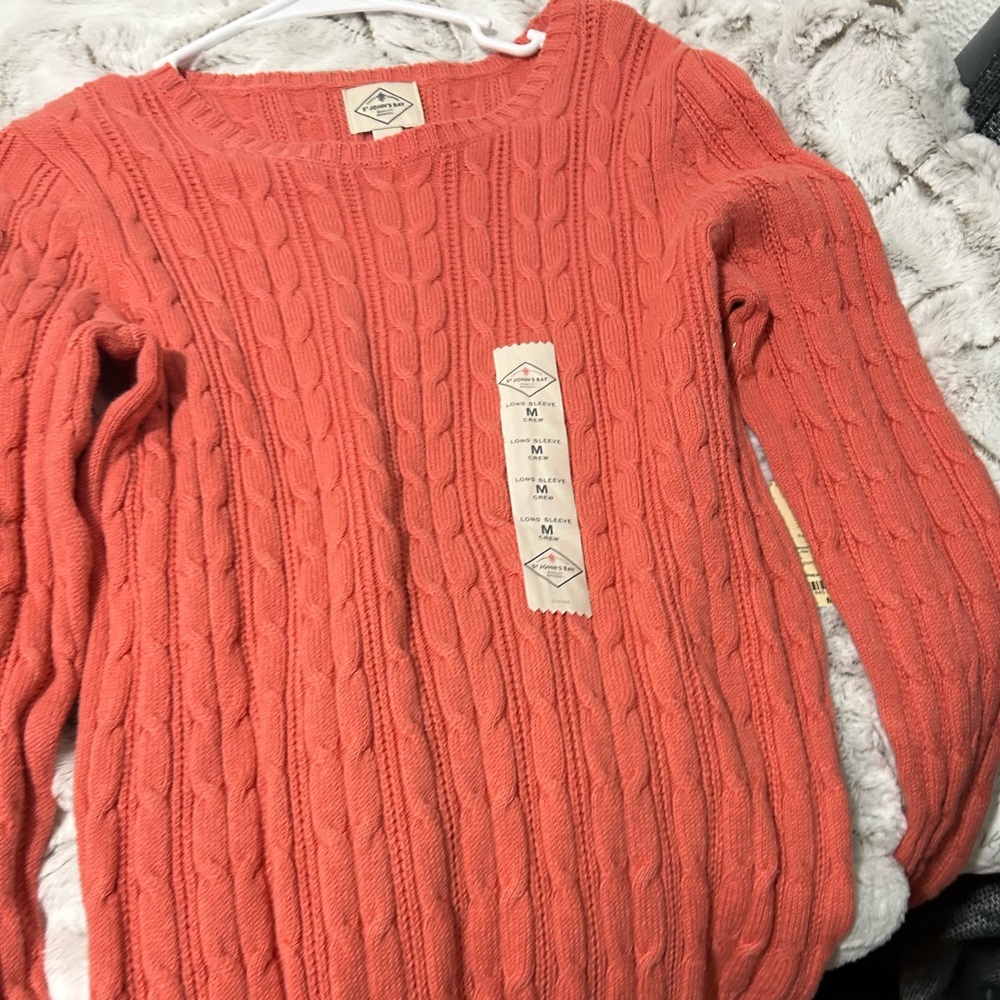 St. John’s bay coral sweater new with tags. Never worn